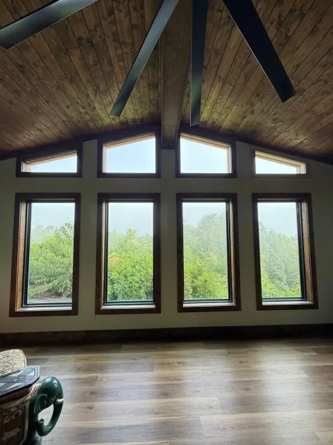 Living Room Addition: Vaulted Gable & Stone Fireplace — Home Addition project by Highlander Building Services in Franklin, NC