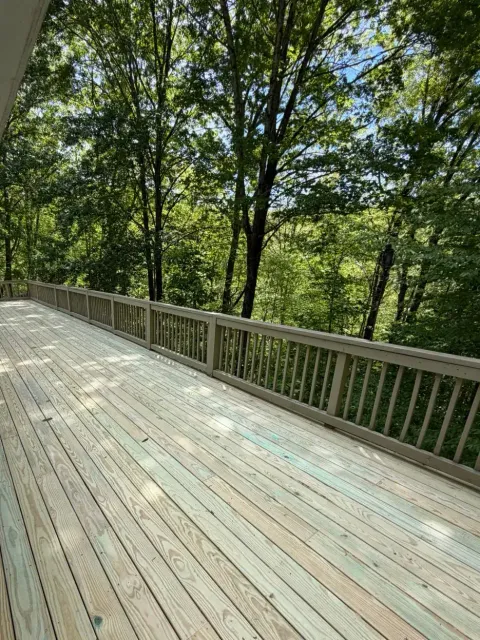 Deck & Railing Rebuild: Elevated Wooded Deck — Deck Rebuild project by Highlander Building Services in Sylva, NC