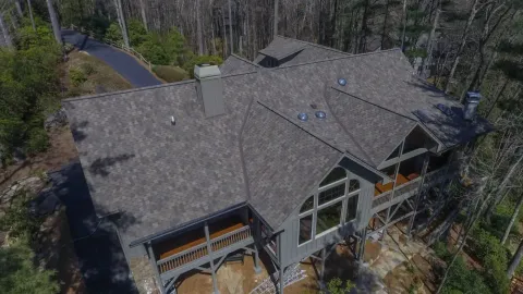 Standing seam metal roof on a mountain home built by Highlander Building Services in Western North Carolina